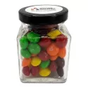 branded 100g Skittles Packed in Small Glass Square Jars, from our range of promotional Lollies &amp; Sweets