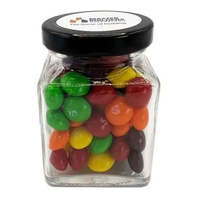 branded 100g Skittles Packed in Small Glass Square Jars, from our range of promotional Lollies & Sweets