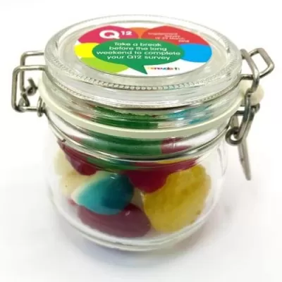 branded 120g Christmas Mixed Lollies Packed in Glass Clip Lock Jars, from our range of promotional Lollies & Sweets
