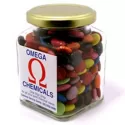branded 170g Chocolate Beans Packed in Glass Square Jars, from our range of promotional Branded Chocolates