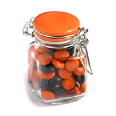 branded 80g Chocolate Beans Packed in Glass Clip Lock Jars, from our range of promotional Branded Chocolates