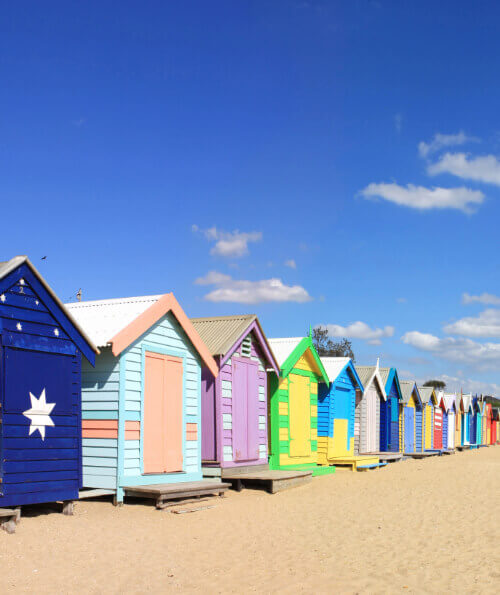 Colourful Brighton Beach bathing boxes on a sunny Australian day