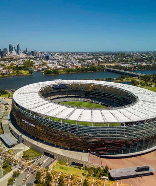 Aerial view of Optus Stadium on the Swan River with Perth skyline
